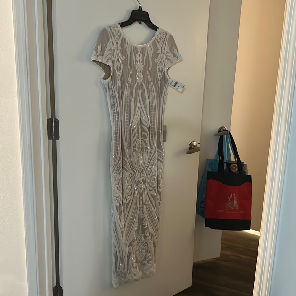 Dress size large cream color long . Never worn.